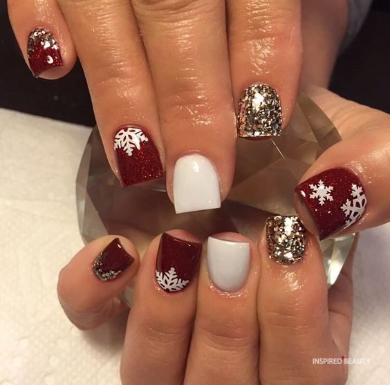 snowflake nails with white, red and gold color