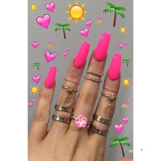 hot pink nails with diamonds on ring finger