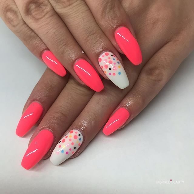 hot pink nails with diamonds on ring finger