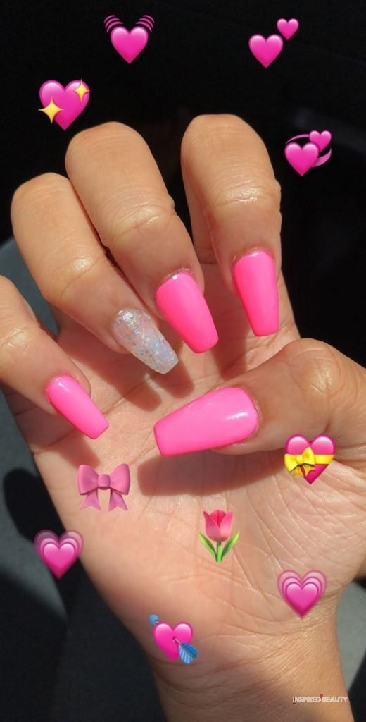 hot pink nails with diamonds on ring finger