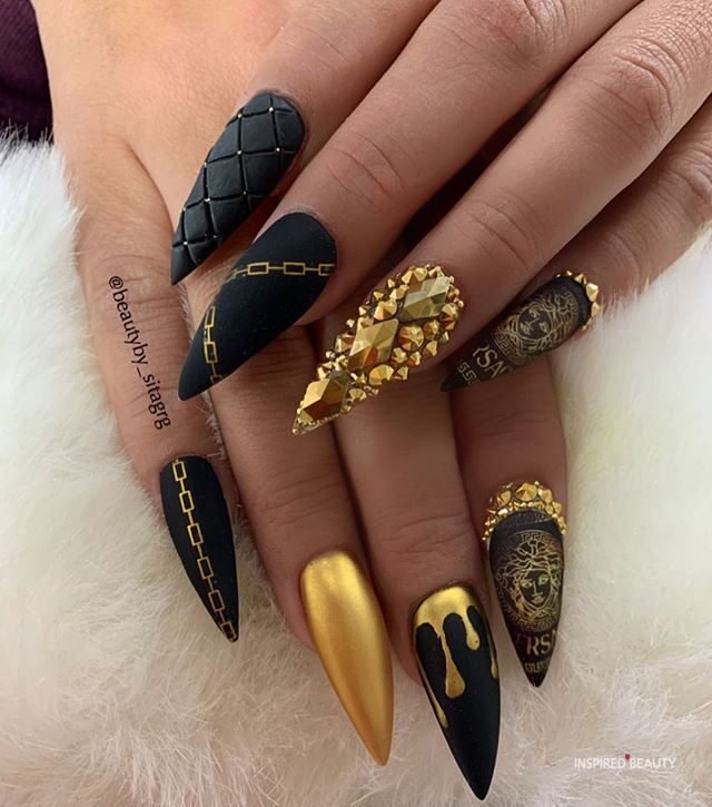 Black and gold Stiletto Nails