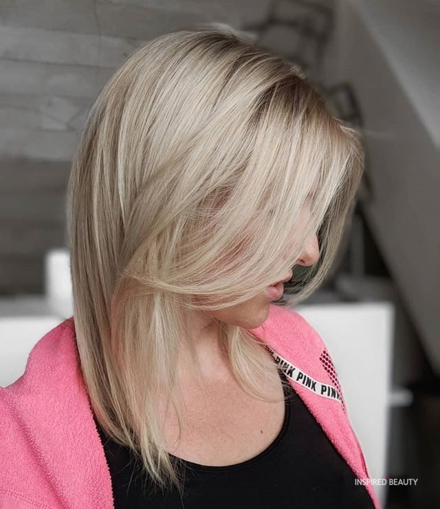 Blonde Medium Length Layered haircut