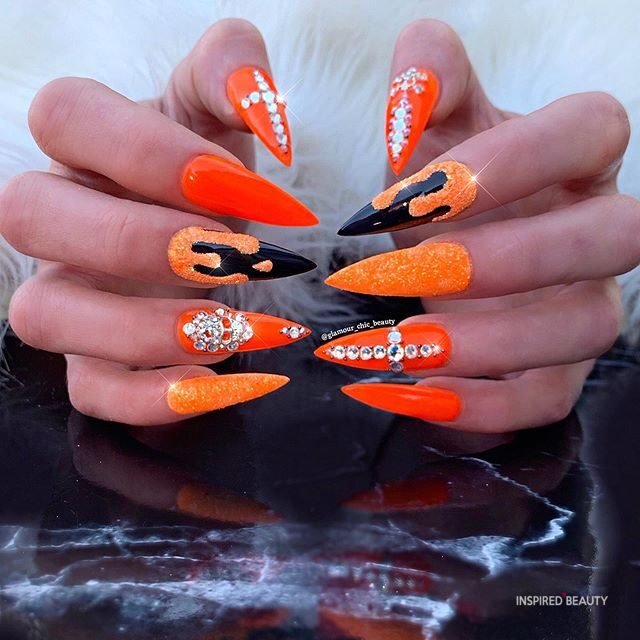 Orange stiletto nails 