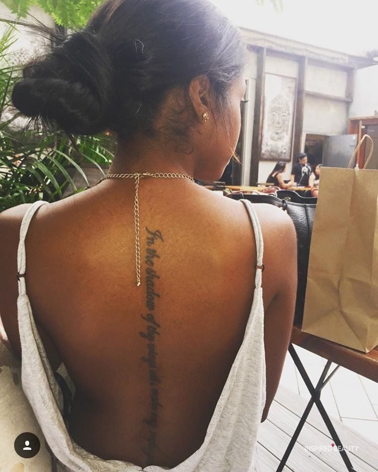 Women back tattoo down the spine
