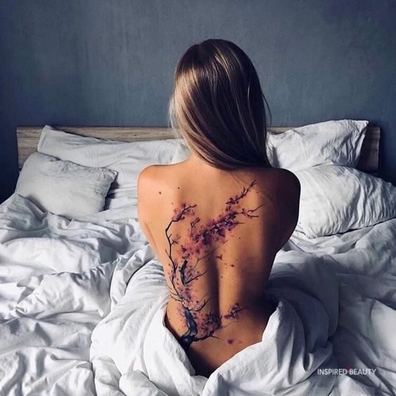 flower spine tattoo