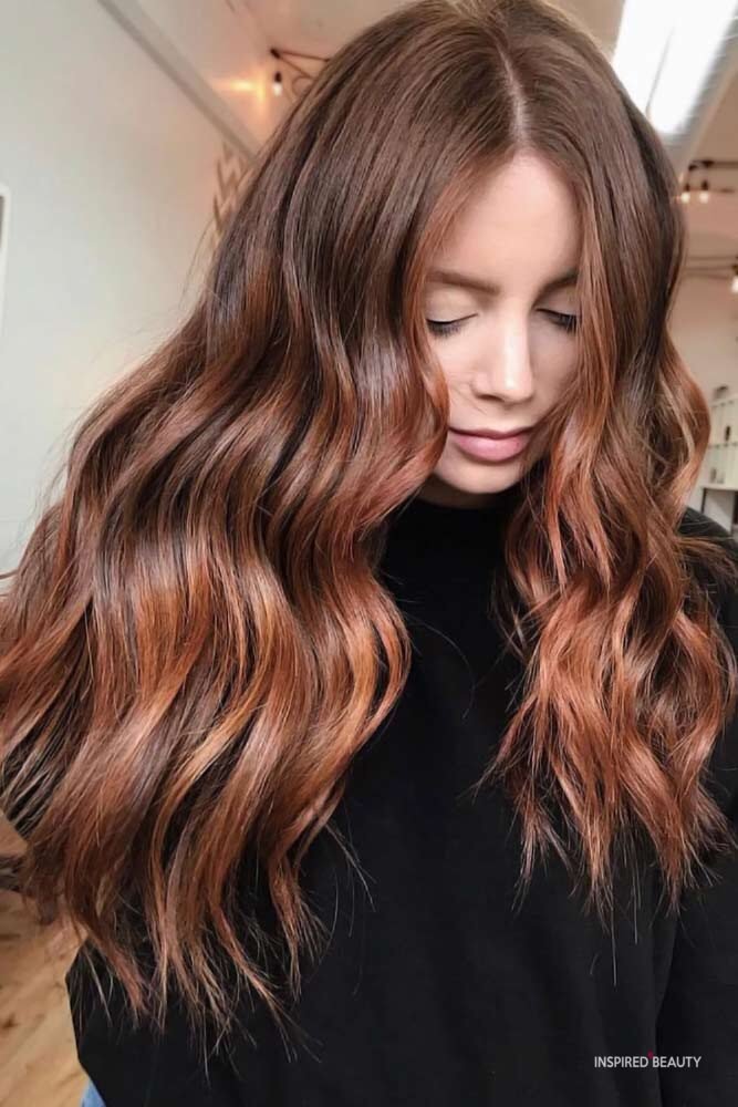 Red balayage on brown hair