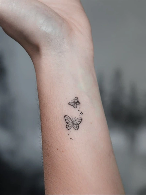 minimalist butterfly tattoo