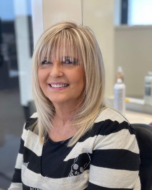 Layered haircut with bang for women over 50