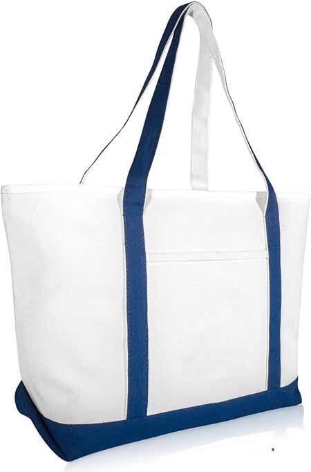 a beach bag in white with blue straps