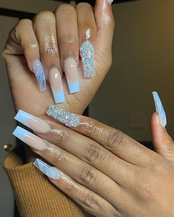Blue long French tip coffin nails with diamonds