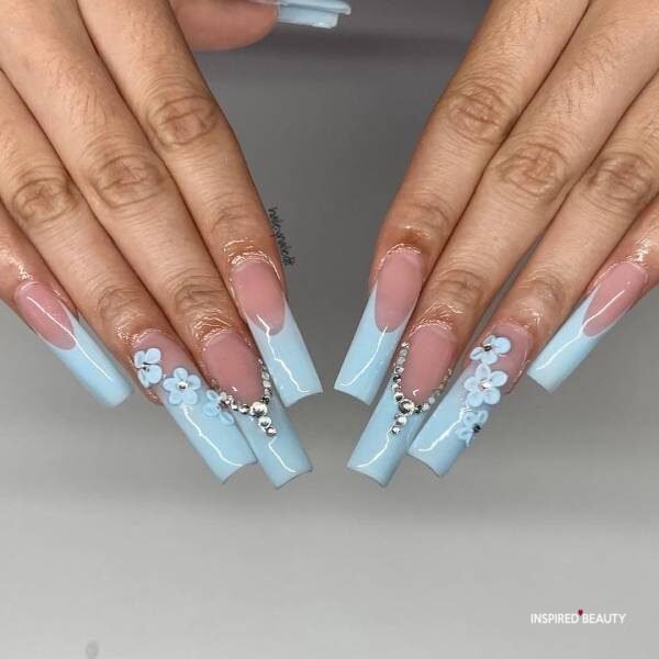 Sky blue long square shape nails with blue floral designs