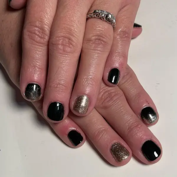 Short Ombre Black and Gold Nails 