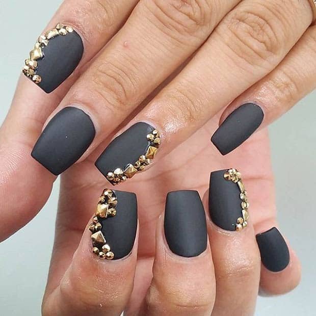 Matte black nails with side rhinestones big and small