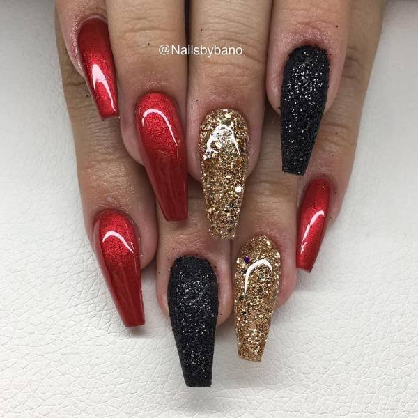 Cherry red nail art with gold and black blend