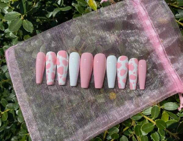 white and pink cow print fake nails