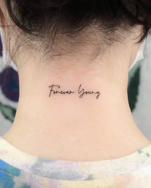 forever young word tattoo on neck back