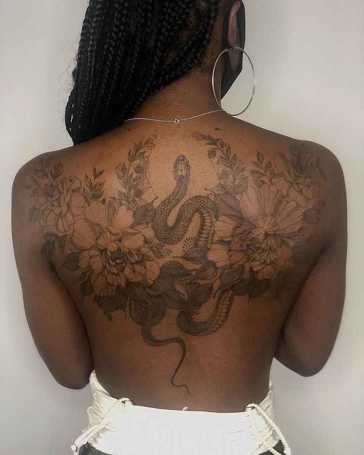 back tattoos for black women with snake adn flowers