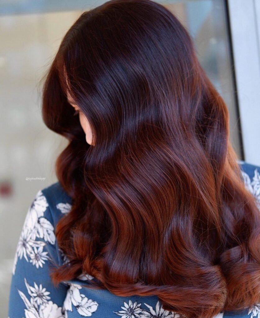 elegant brown balyage hair color for any season. This hair is full and bouncy