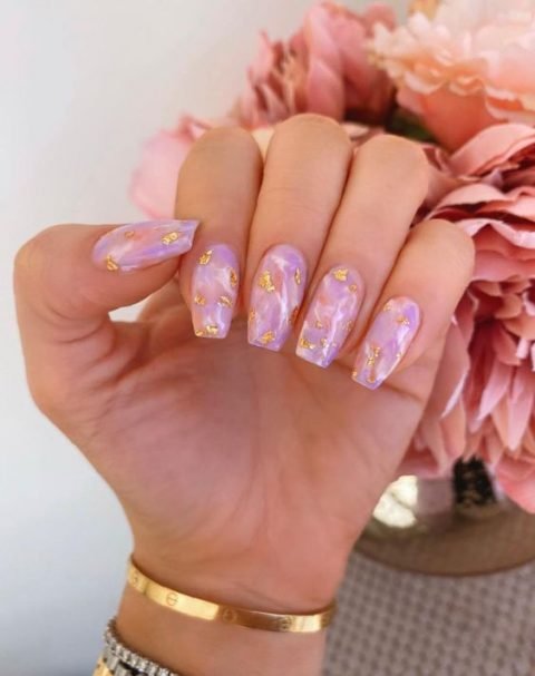 purple nail with gold decals