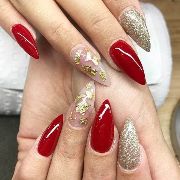 Red and gold mountain peek acrylic nails design ideas