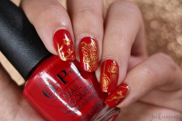 round oval red and gold nails designed acrylic nail art 