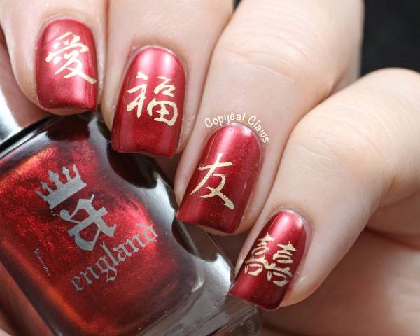 Short nails with cute characters gold and red design ideas