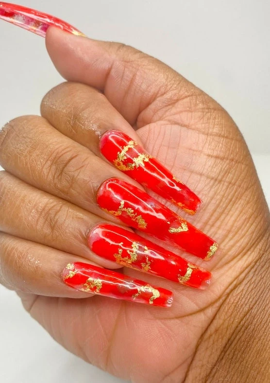 glamorous long red and gold nails