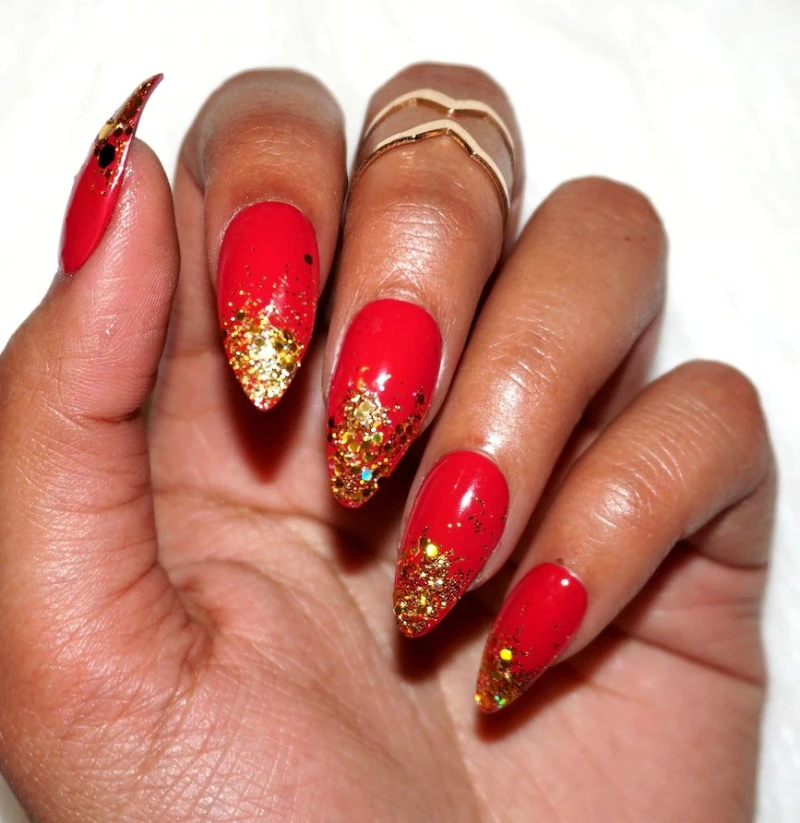 Red Glitter gold tip design Almond red nails