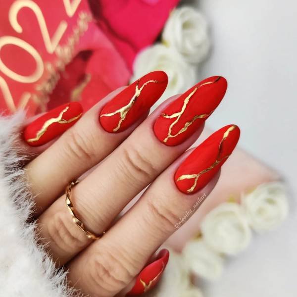 Cute oval long red nails with a simple design idea