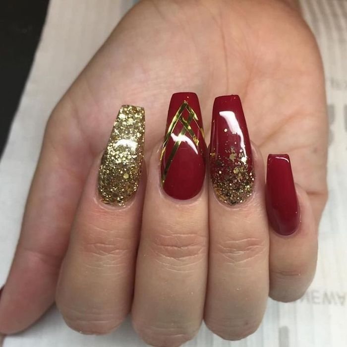 Coffin red and gold nails ideas with splatter design