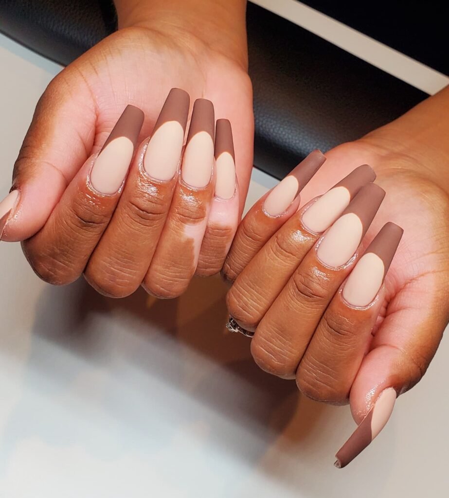 Brown french tip nails designed for fall