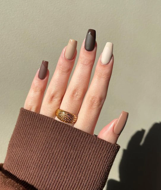 nude and brown manicure nails