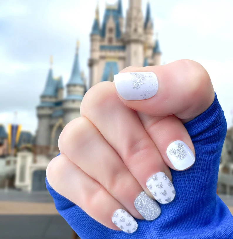 white Mickey Mouse nail art withs ilver