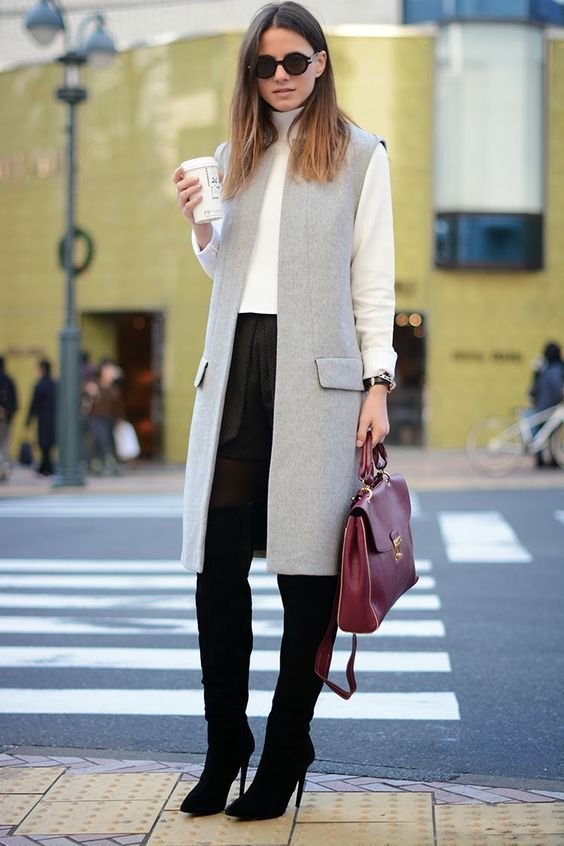 Sleeveless Gray Coat with Long Sleeve cardigan Sweater and work Pants.