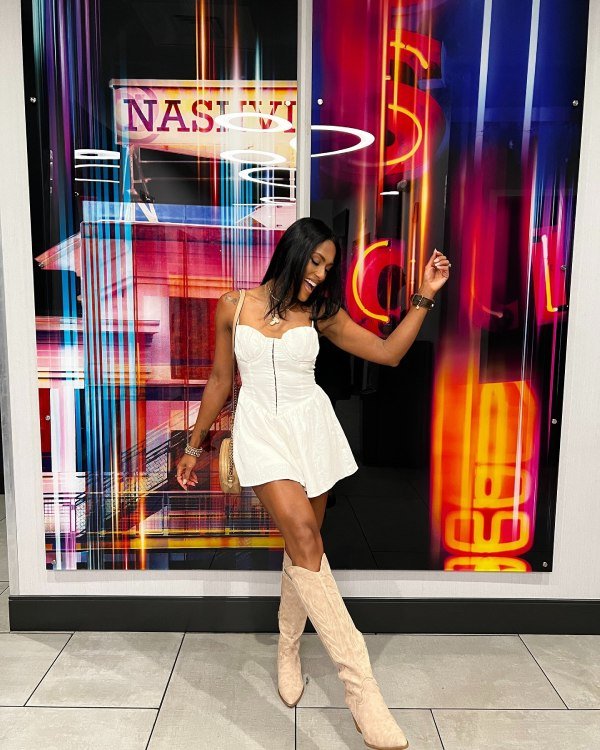 Cute nasville outfit idea for woman. Cream boots and mini Dress.