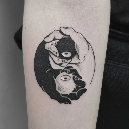 Black and white Yin yang eye and hand creative unique tattoo idea