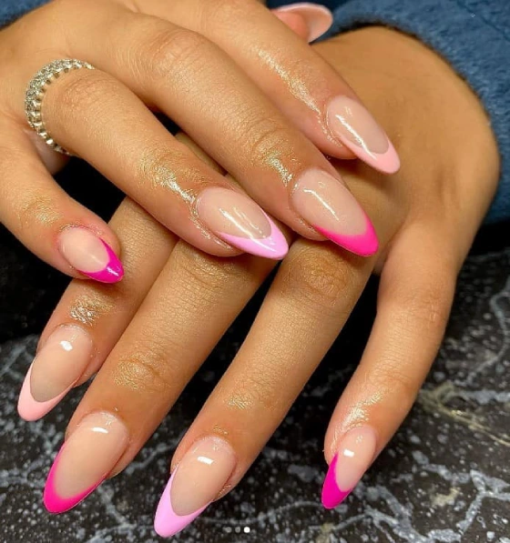 women with arrow head nails, pink french tip nails, cute french tip design