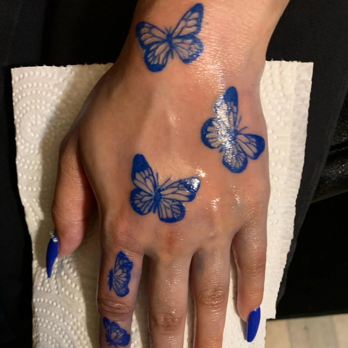 Blue Butterfly Tattoo on Hand