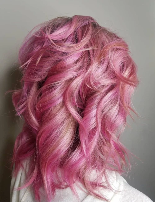 Beautiful Wavy Pink hair with orange highlights for long hairstyles