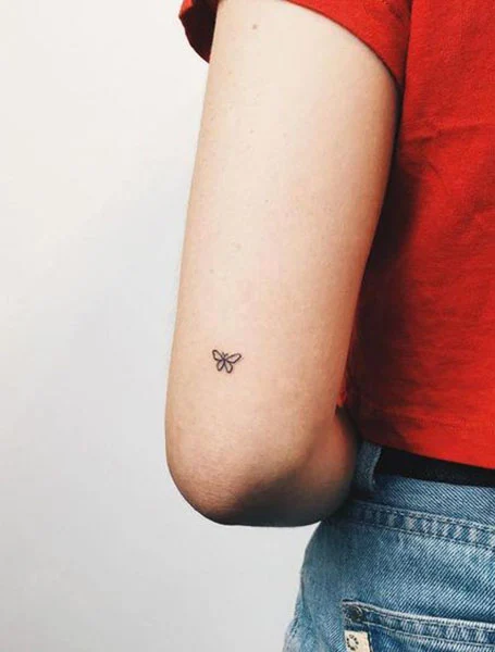 Cute Tiny buutterfly tattoo 