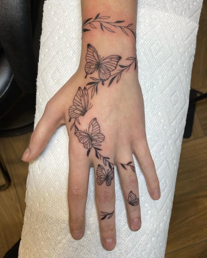 Butterfly tattoo on hand and wrist