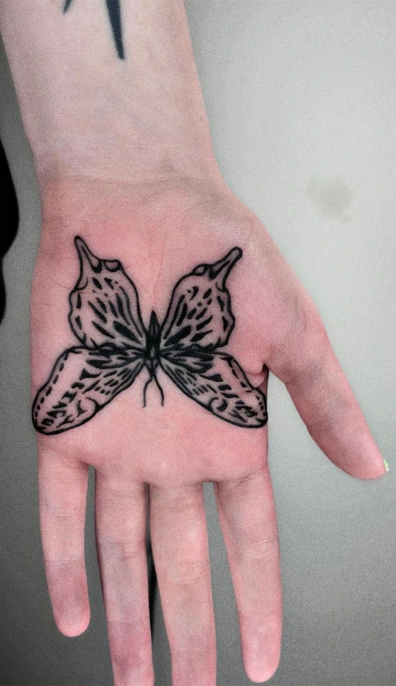 butterfly tatoo in the palm of the hands