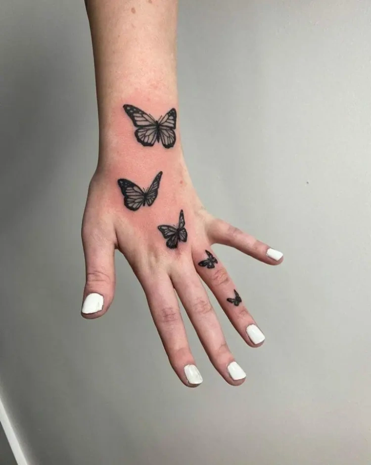 small butterfly tattoos on hand