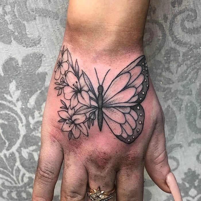 half butterfly half flower tattoo