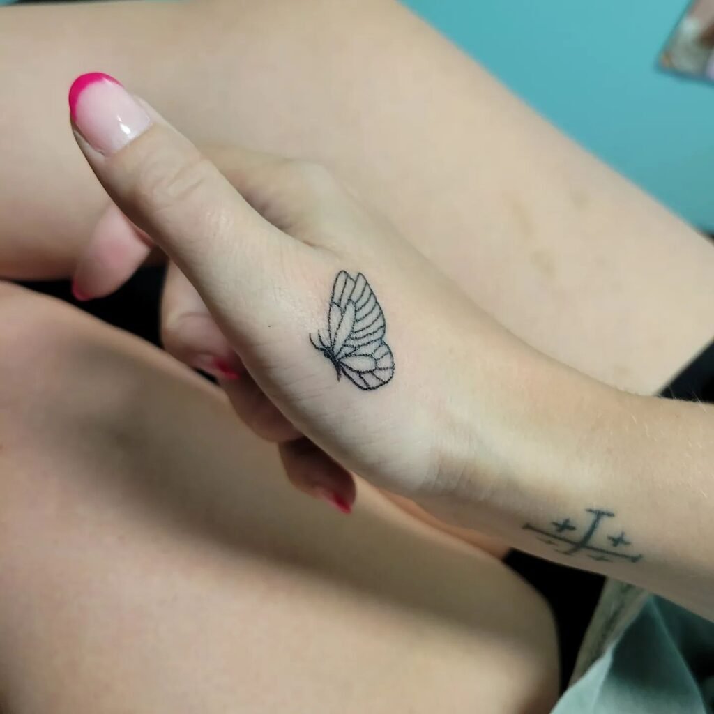 small butterfly tattoos on hand