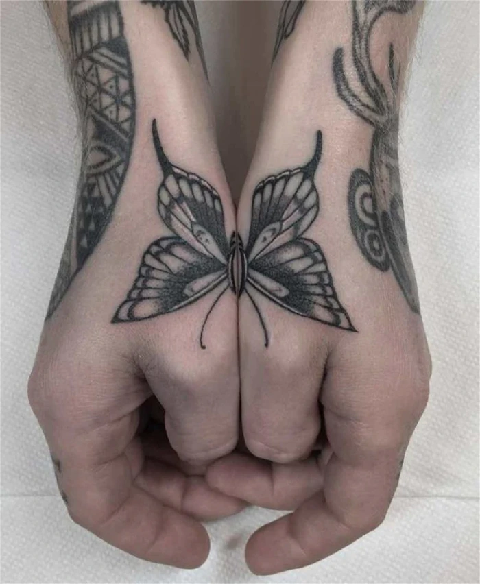 butterfly tattoo on hand