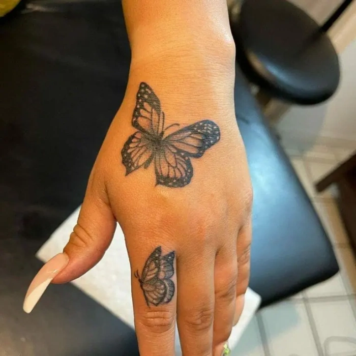 hand butterflies tattoo