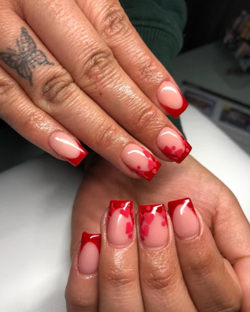 Red heart French tip nails design