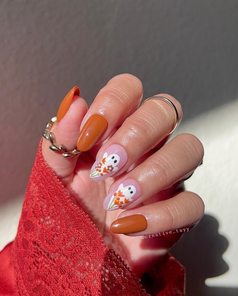 Ghost white and orange color nails