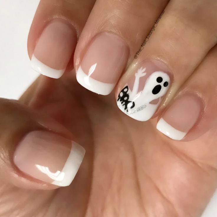 Spooky Halloween nail art design French tip white and short ghost nails